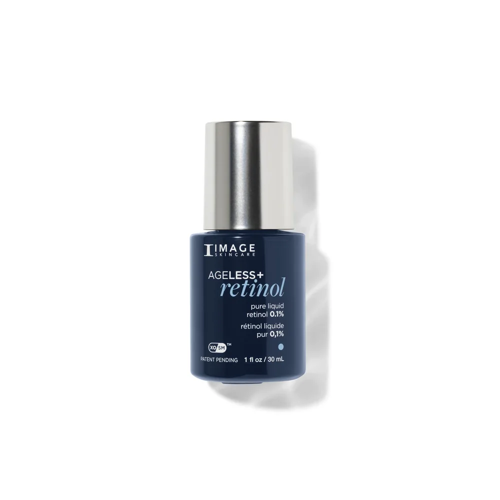 A small dark navy glass bottle of 0.1% liquid retinol with a silver cap, on a white background